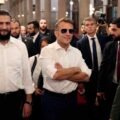 Explosions shake Damascus as Macron visits